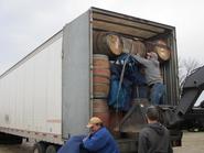 A ful load of wine barrels, rain barrels, and planters